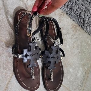 Tory burch sandals, snake print, with brown leather Tory Burch emblem.